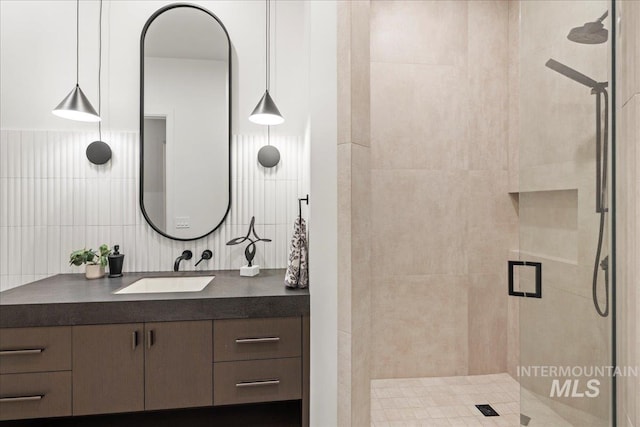1112 W Main St Unit 503, Boise, ID 83702 - bathroom featuring a stall shower, vanity, and backsplash