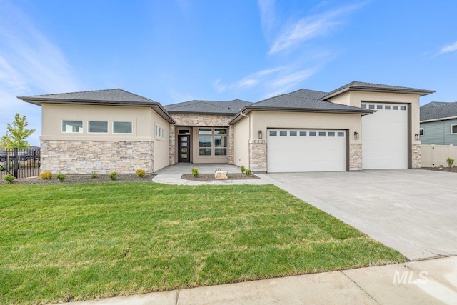 prairie-style home with a garage, stone siding, concrete driveway, and stucco siding