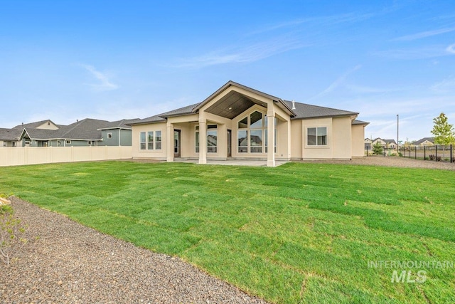 back of property featuring stucco siding and a patio
