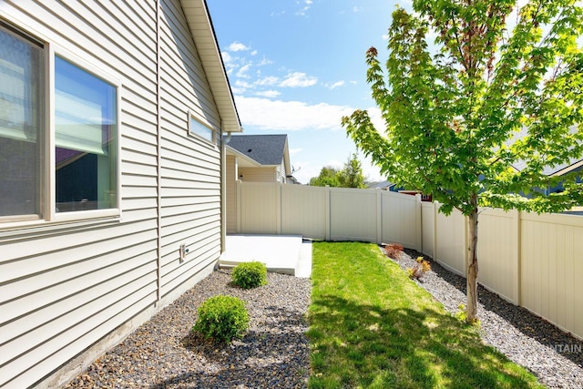 view of yard with a fenced backyard