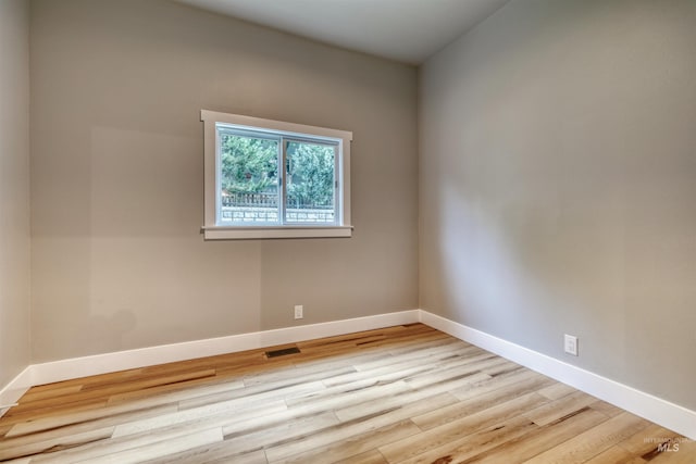 1605 N 5th St, Boise, ID 83702 - unfurnished room with baseboards and wood finished floors