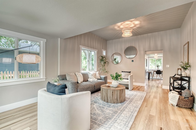 1605 N 5th St, Boise, ID 83702 - living area featuring healthy amount of natural light and wood finished floors