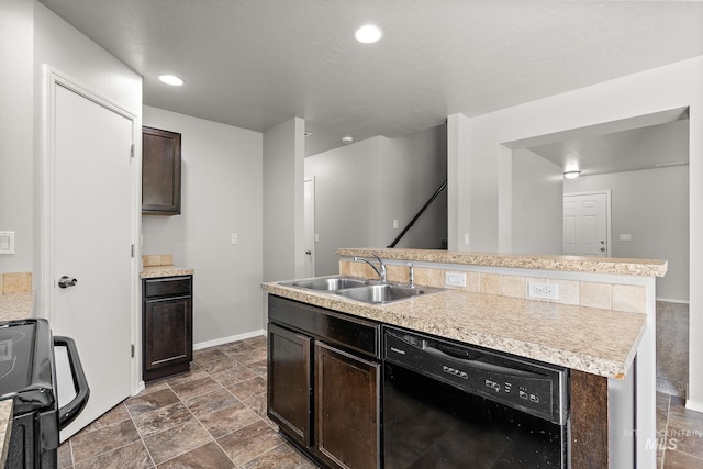 10619 Tysen Springs St, Nampa, ID 83687 - kitchen featuring dishwasher, a sink, range, an island with sink, and light countertops