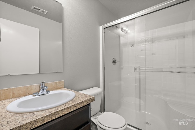 10619 Tysen Springs St, Nampa, ID 83687 - full bathroom featuring toilet, a shower stall, and vanity