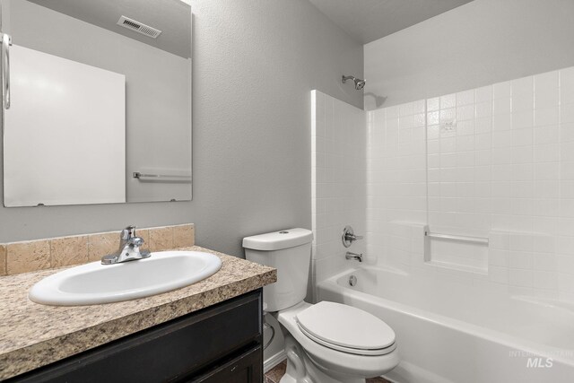 10619 Tysen Springs St, Nampa, ID 83687 - full bath featuring toilet, vanity, and washtub / shower combination