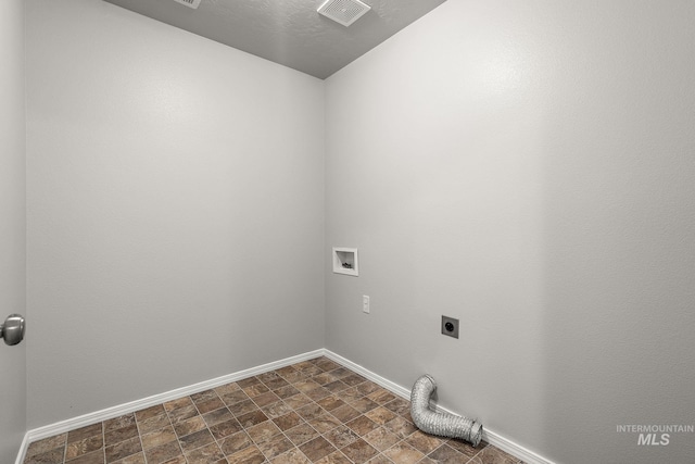 10619 Tysen Springs St, Nampa, ID 83687 - laundry area with hookup for an electric dryer, baseboards, washer hookup, and stone finish flooring