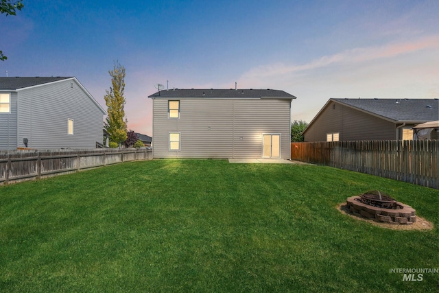 10619 Tysen Springs St, Nampa, ID 83687 - rear view of house with a fire pit