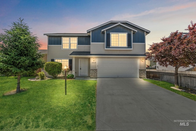 10619 Tysen Springs St, Nampa, ID 83687 - traditional home with board and batten siding, a garage, driveway, and brick siding