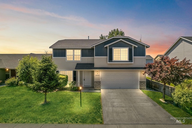 10619 Tysen Springs St, Nampa, ID 83687 - traditional home featuring board and batten siding, an attached garage, a yard, driveway, and brick siding