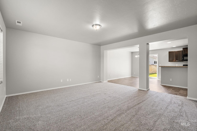 10619 Tysen Springs St, Nampa, ID 83687 - unfurnished living room featuring carpet and baseboards