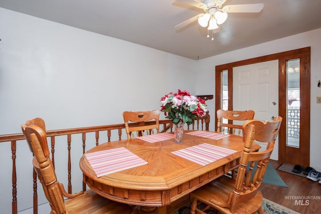 dining room with a ceiling fan and light wood finished floors