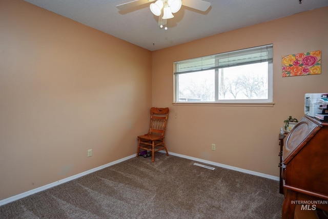 interior space with a ceiling fan, visible vents, and baseboards