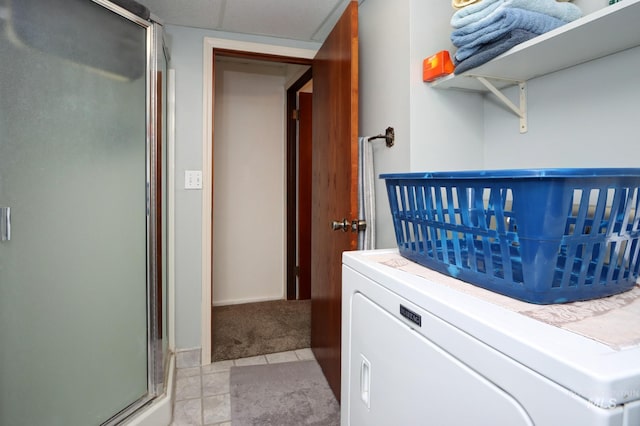 interior space featuring washer / clothes dryer and carpet floors