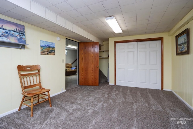 interior space with carpet flooring and baseboards