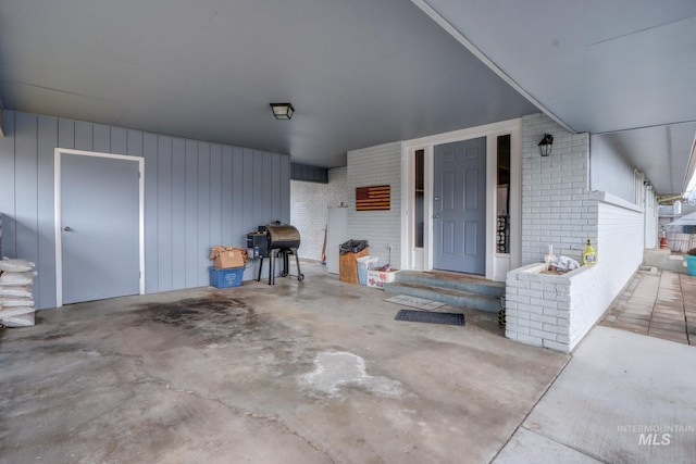 exterior space featuring brick siding