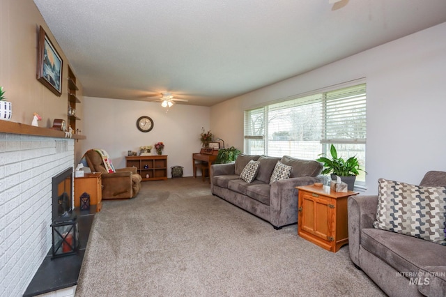 living room featuring light colored carpet, a fireplace, and ceiling fan