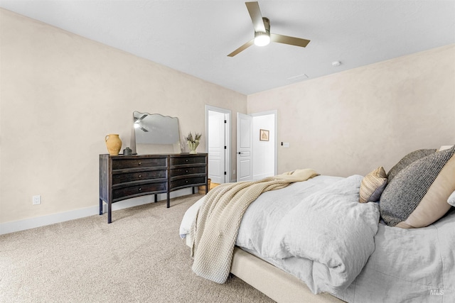 bedroom featuring ceiling fan and carpet