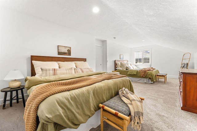 carpeted bedroom featuring lofted ceiling and a textured ceiling