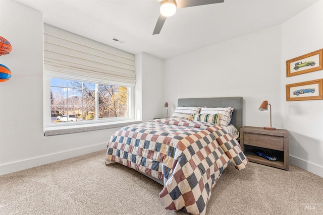 bedroom featuring ceiling fan and carpet