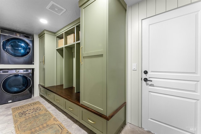 laundry area with stacked washer / drying machine