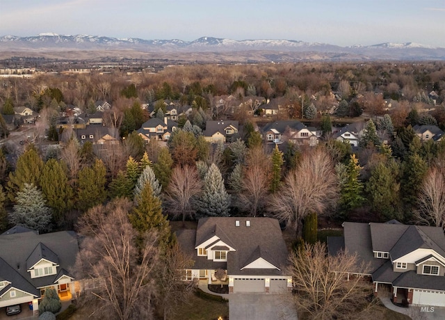 birds eye view of property with a mountain view