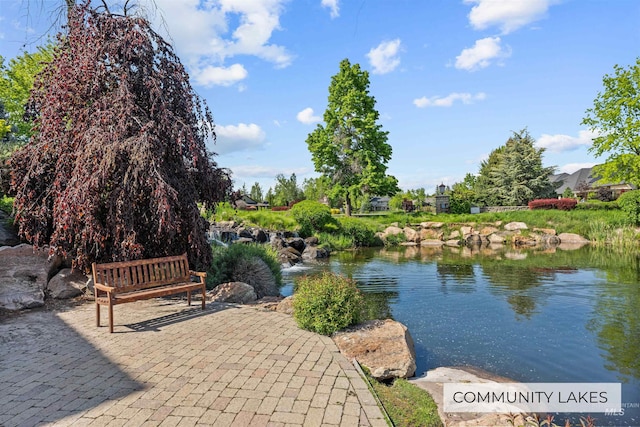 surrounding community with a water view