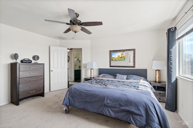398 N Pebble Beach Way, Eagle, ID 83616 - bedroom with light colored carpet, ceiling fan, and connected bathroom