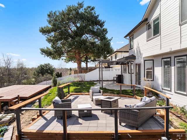 398 N Pebble Beach Way, Eagle, ID 83616 - wooden terrace featuring an outdoor living space with a fire pit, fence, and a patio area