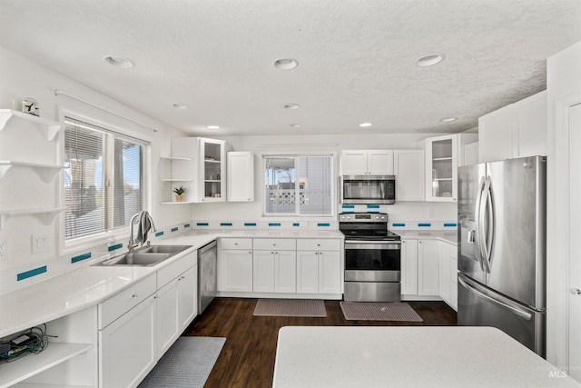 398 N Pebble Beach Way, Eagle, ID 83616 - kitchen with open shelves, appliances with stainless steel finishes, a sink, white cabinets, and recessed lighting