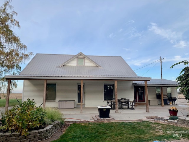 rear view of house with a lawn