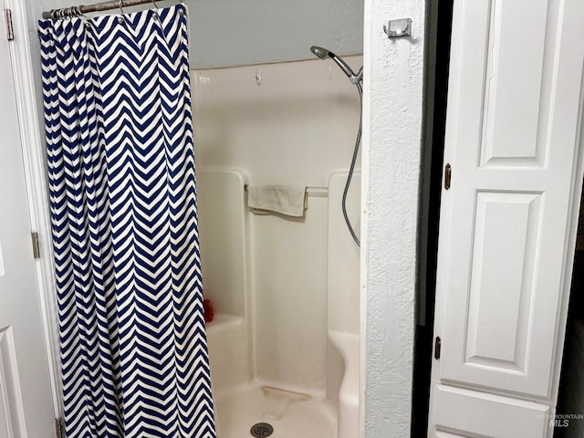 bathroom with curtained shower