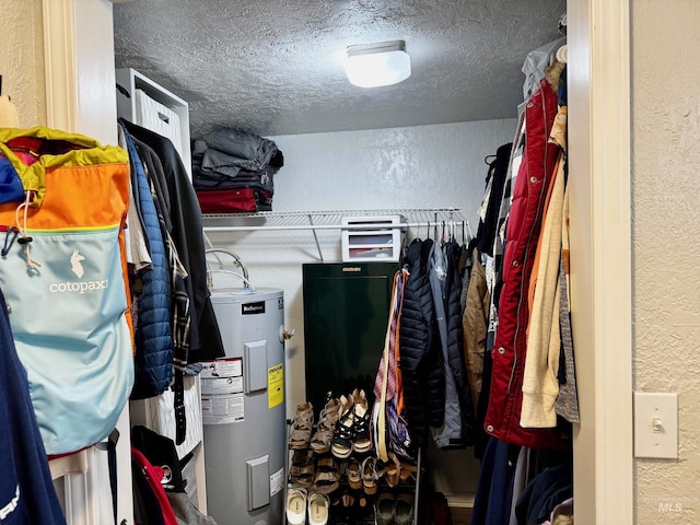 utility room with water heater