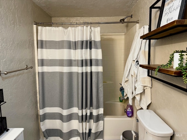 bathroom with a textured ceiling and shower / bath combo with shower curtain