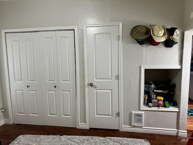 bedroom featuring dark wood-type flooring