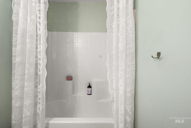 full bathroom with shower / bath combo with shower curtain