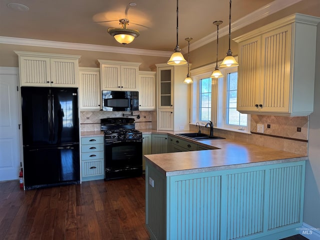 kitchen with a peninsula, dark wood-type flooring, a sink, ornamental molding, and black appliances