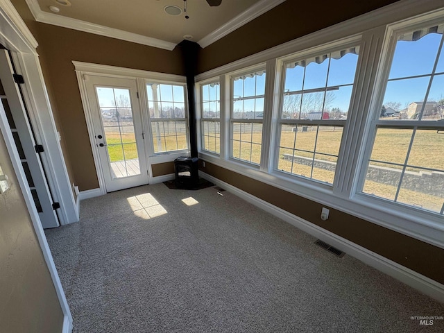 unfurnished sunroom with visible vents