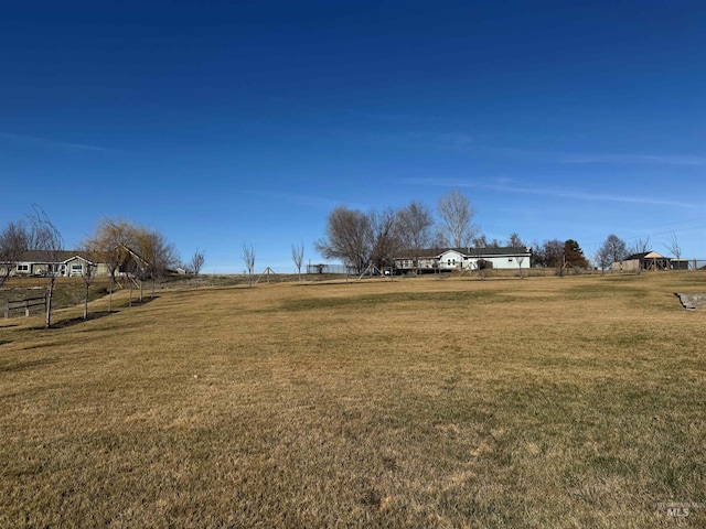 view of yard with a rural view