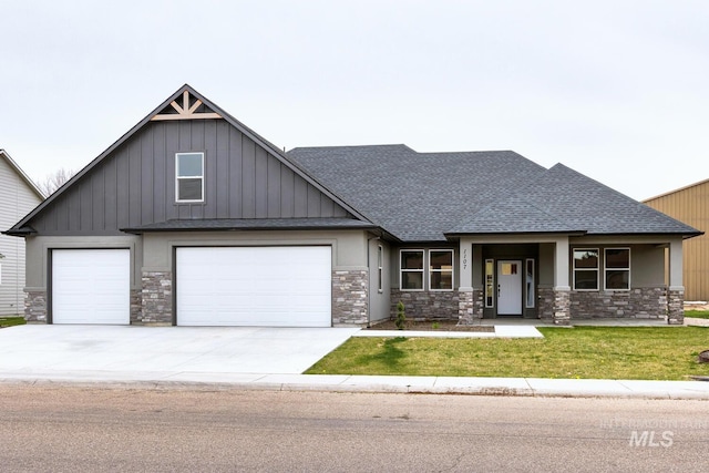 craftsman house featuring a front yard, an attached garage, stone siding, concrete driveway, and roof with shingles