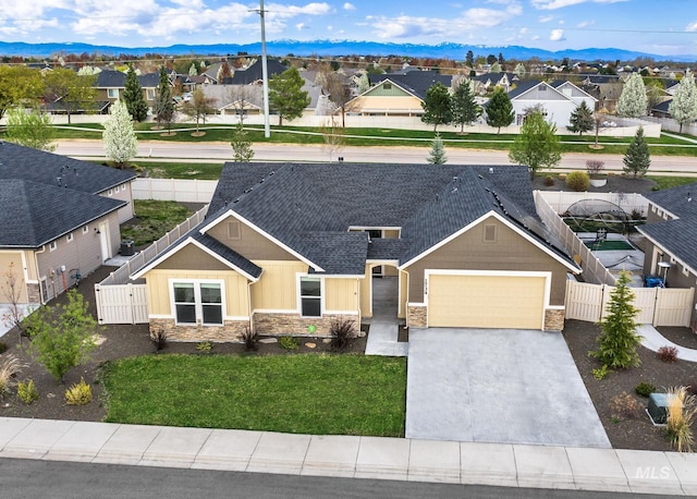 1734 Shoal Point Ave, Middleton, ID 83644 - view of front facade featuring a residential view, stone siding, and fence