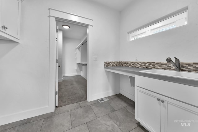 1734 Shoal Point Ave, Middleton, ID 83644 - bathroom with tasteful backsplash, vanity, visible vents, tile patterned floors, and baseboards