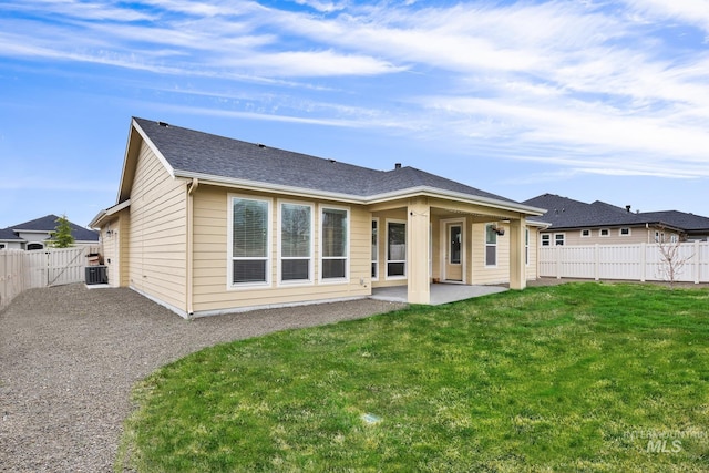 1734 Shoal Point Ave, Middleton, ID 83644 - rear view of house with cooling unit, a yard, a patio area, and a fenced backyard