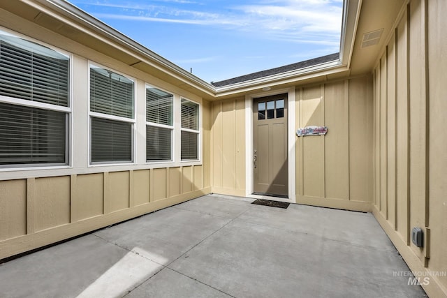 1734 Shoal Point Ave, Middleton, ID 83644 - doorway to property featuring a patio area and board and batten siding