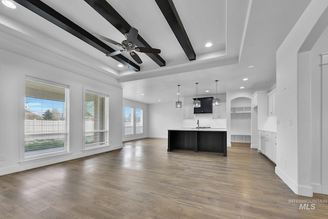 1734 Shoal Point Ave, Middleton, ID 83644 - kitchen with white cabinets, open floor plan, a ceiling fan, a tray ceiling, and recessed lighting