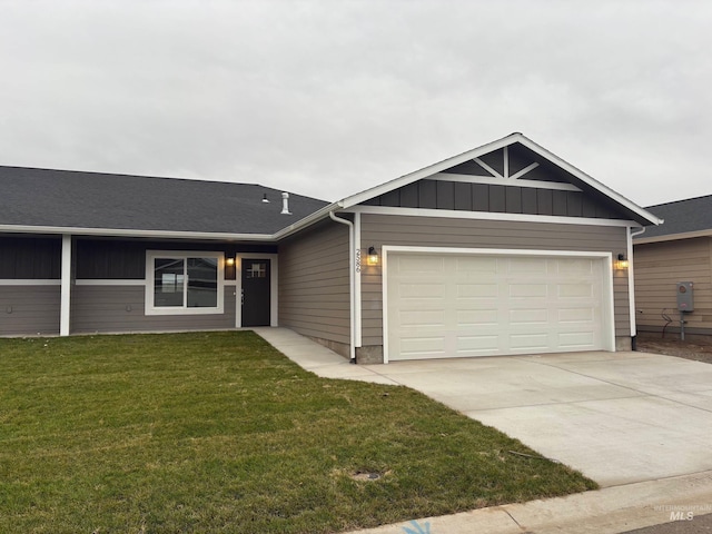 view of front of home with a garage and a front yard