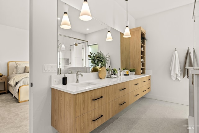 bathroom featuring vanity and a shower with shower door