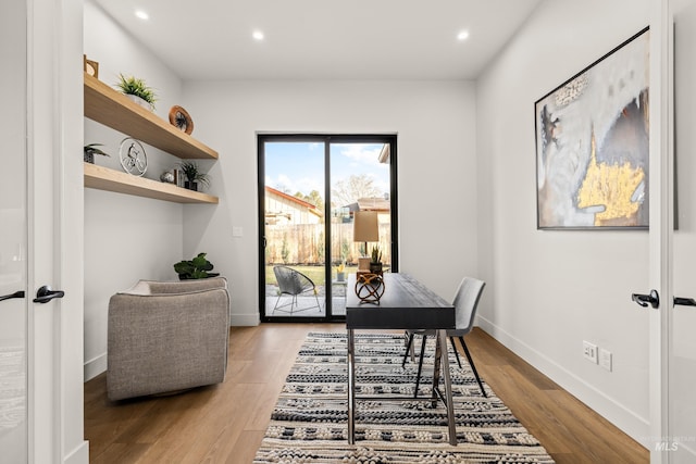 office space featuring light wood-type flooring and french doors