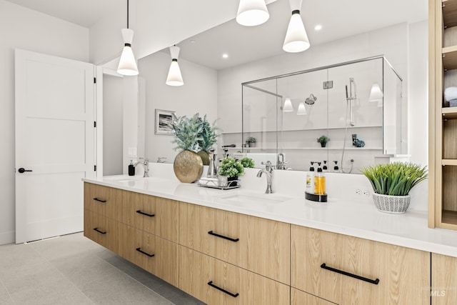 bathroom with vanity and an enclosed shower