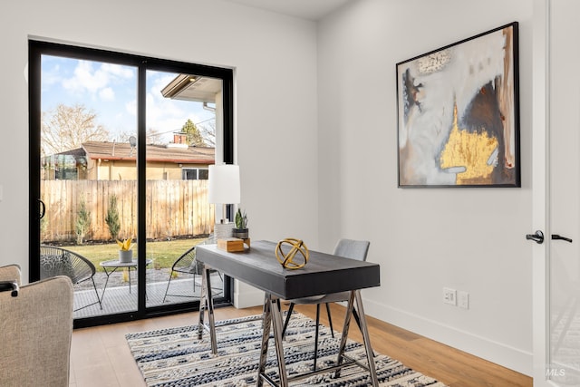 office space with wood-type flooring