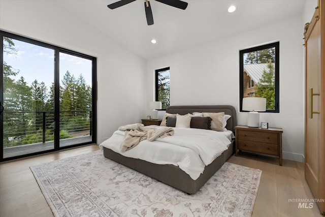 1678 Majestic View Dr, Mccall, ID 83638 - bedroom with multiple windows, recessed lighting, vaulted ceiling, light wood-style floors, and a ceiling fan